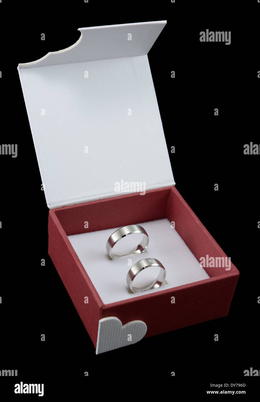 Pair of wedding rings in open box, isolated on black. Stock Photo