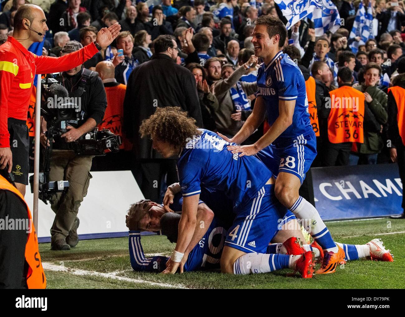 London, UK. 08th Apr, 2014. Chelsea team mates mob Demba Ba after he scored the late winner during the UEFA Champions League match between Chelsea and Paris St-Germain from Stamford Bridge Credit:  Action Plus Sports/Alamy Live News Stock Photo