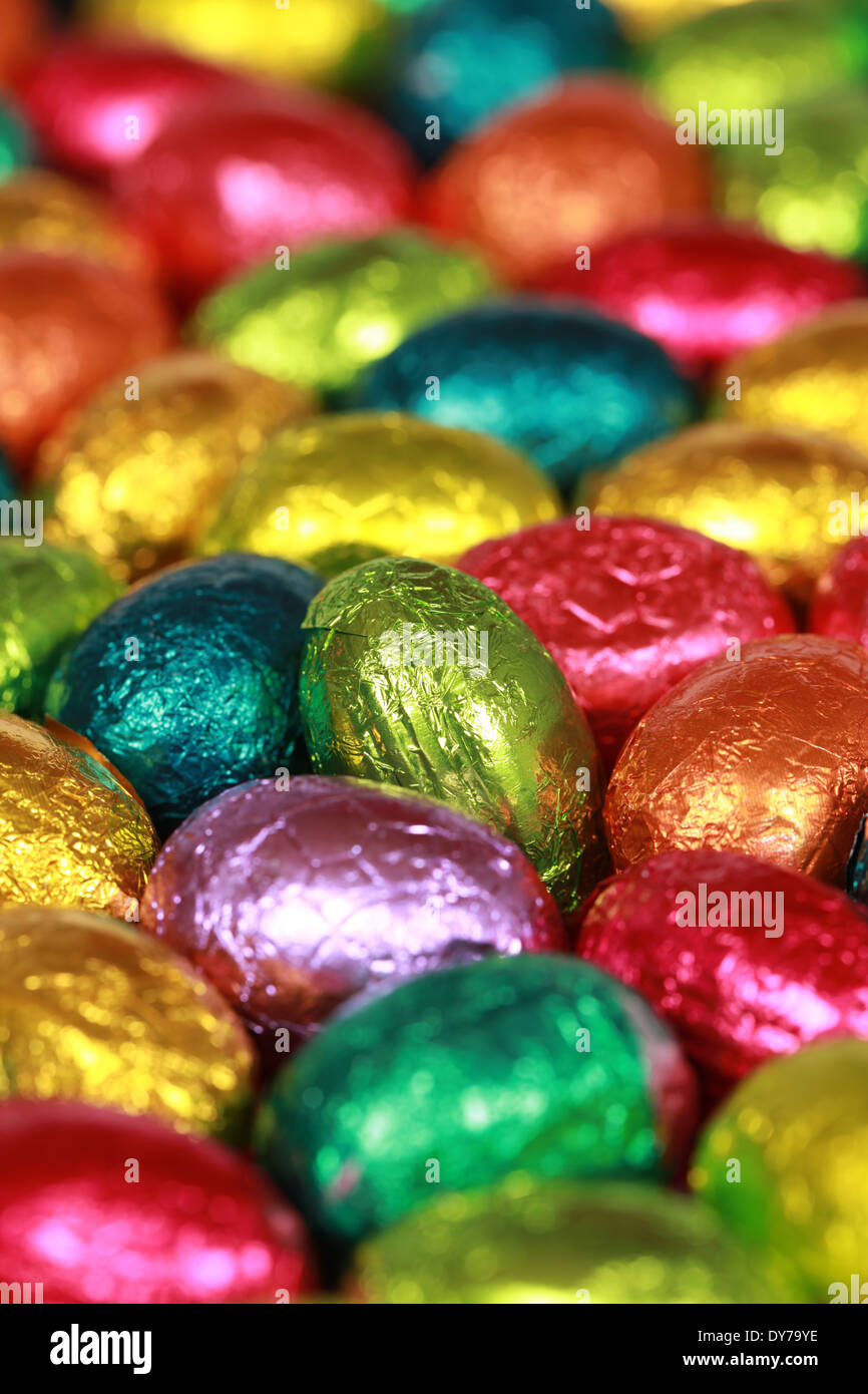 Colorful Easter eggs made of chocolate forming a background Stock Photo