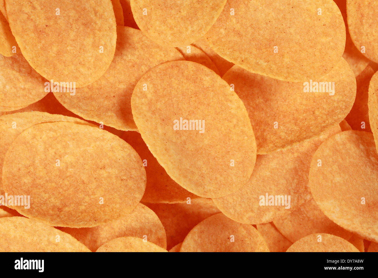 Collection of potato chips forming a background Stock Photo