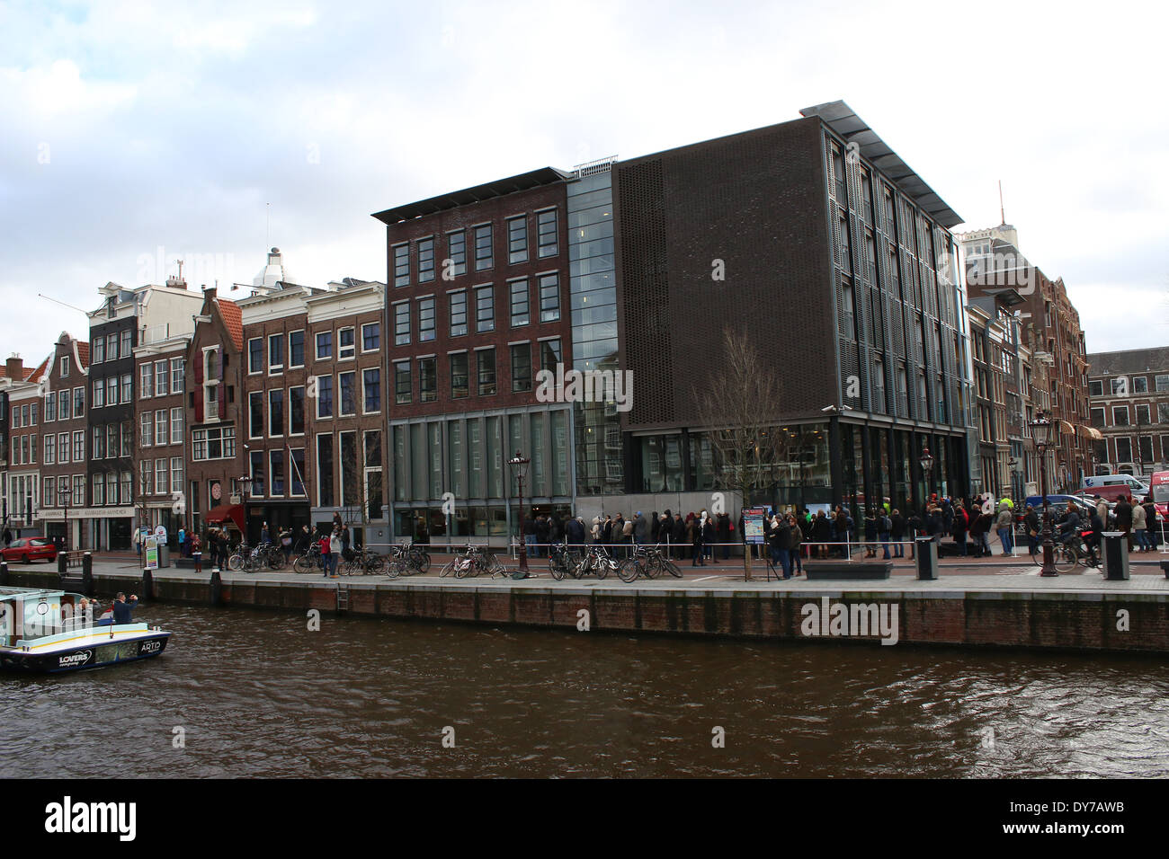 People standing in line in front of the Anne Frank House Museum (Achterhuis/Secret Annex) at  Prinsengracht canal, Amsterdam Stock Photo