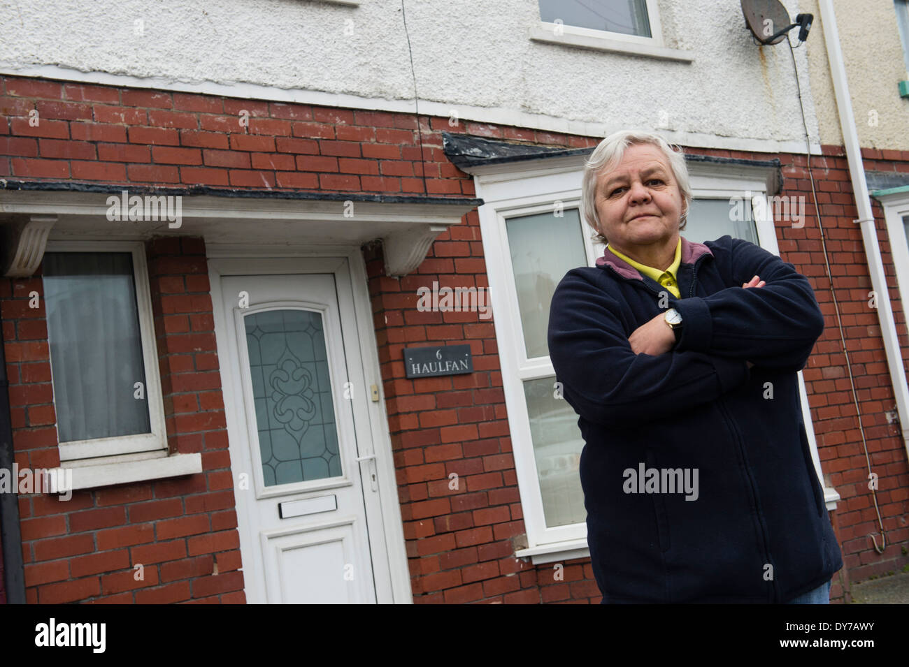 Enid Jones, standing outside her home in Greenfield Street Aberystwyth