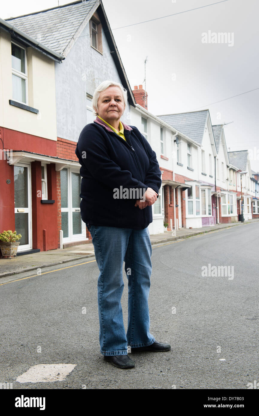 Enid Jones, standing outside her home in Greenfield Street Aberystwyth