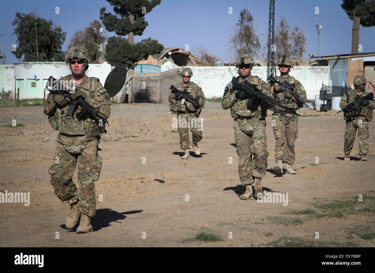 US soldiers patrol a village March 26, 2014 in Kandahar Province, Afghanistan. Stock Photo