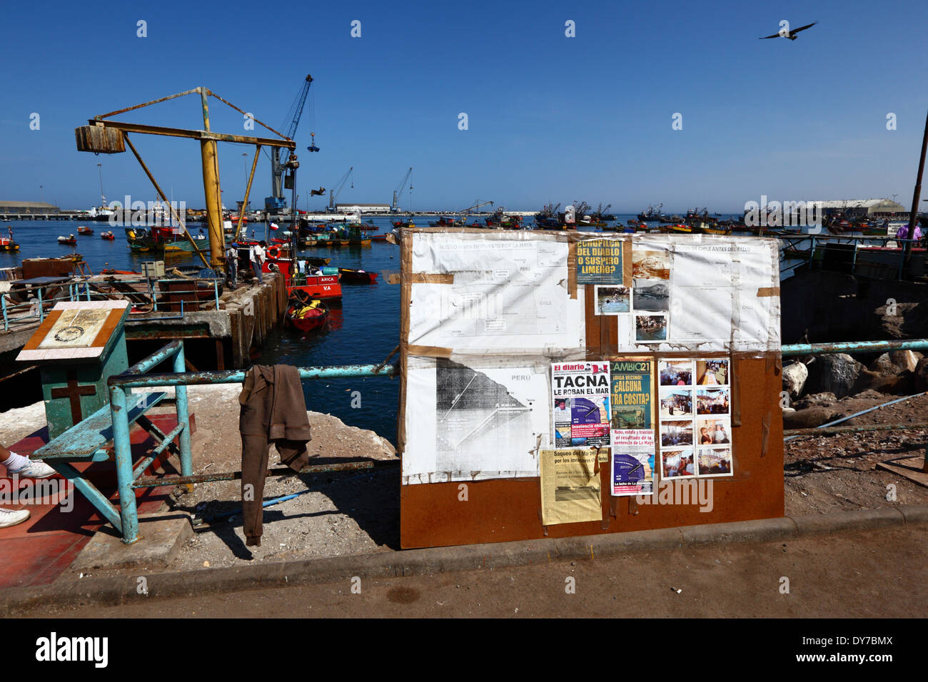 Notice board in fishing docks with information about The Hague ruling on Chile -Peru maritime border dispute, Arica, Chile Stock Photo