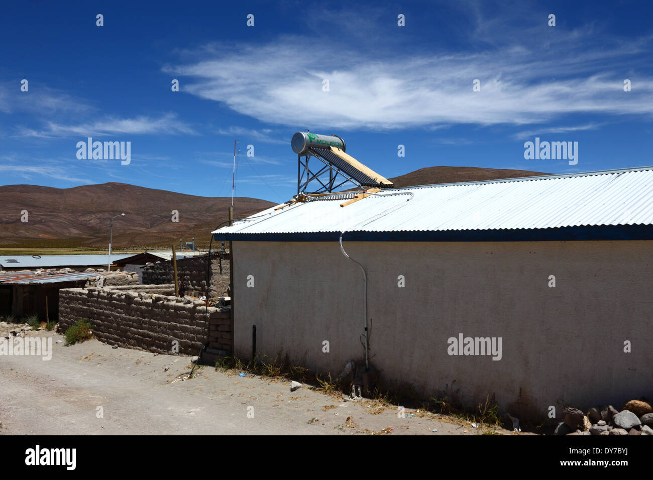 Solar powered water heater on roof of building in village in Chilean altiplano, Region I , Chile Stock Photo