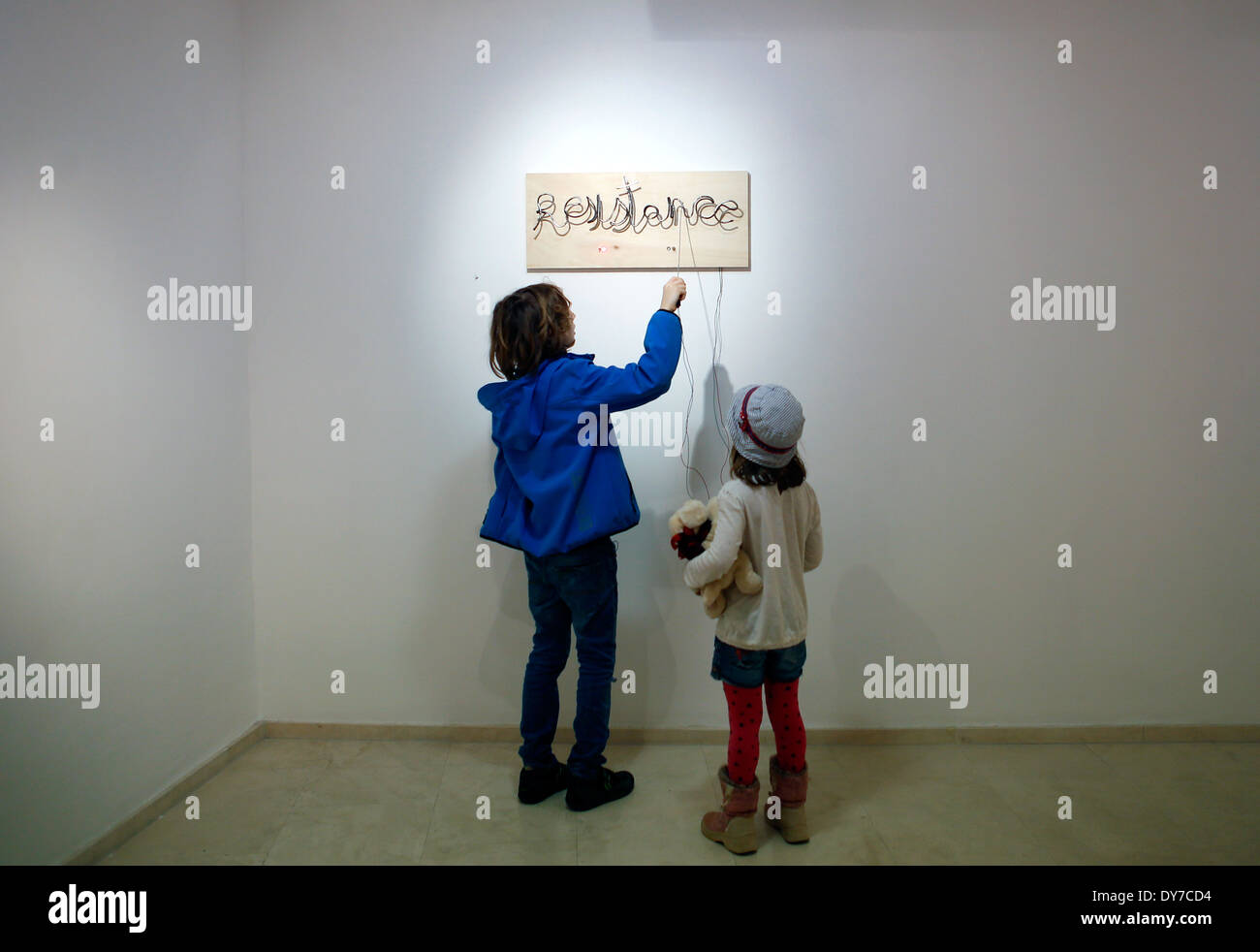 Childs interact with a piece of art at an art exhibit in the island of Majorca, Spain Stock Photo