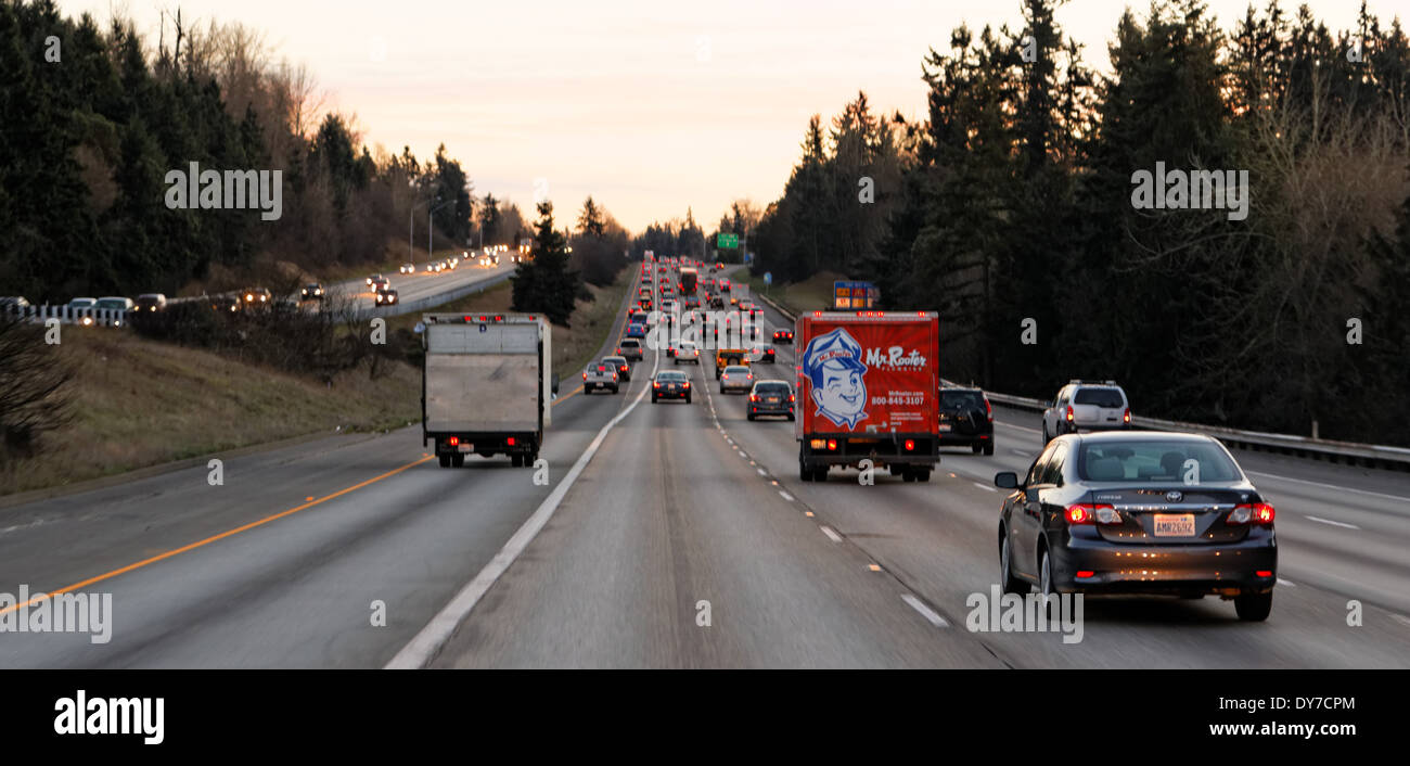 41,675.04268a Evening heavy rural automobile car truck 4 lane straight Interstate highway traffic transportation travel crowded Stock Photo