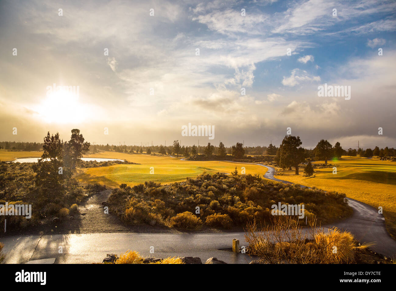 Storm on the horizon at dawn in this landscape nature photo of a golf course in Central Oregon. Stock Photo