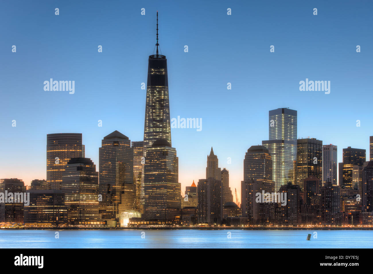 The Freedom Tower and other buildings of the lower Manhattan skyline before sunrise in New York City. Stock Photo