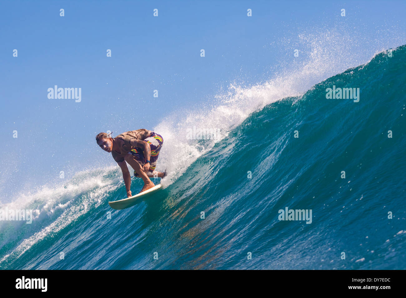 Surfing Java Surfing a wave. GLand surf area.Java island.Indonesia Stock Photo - Alamy