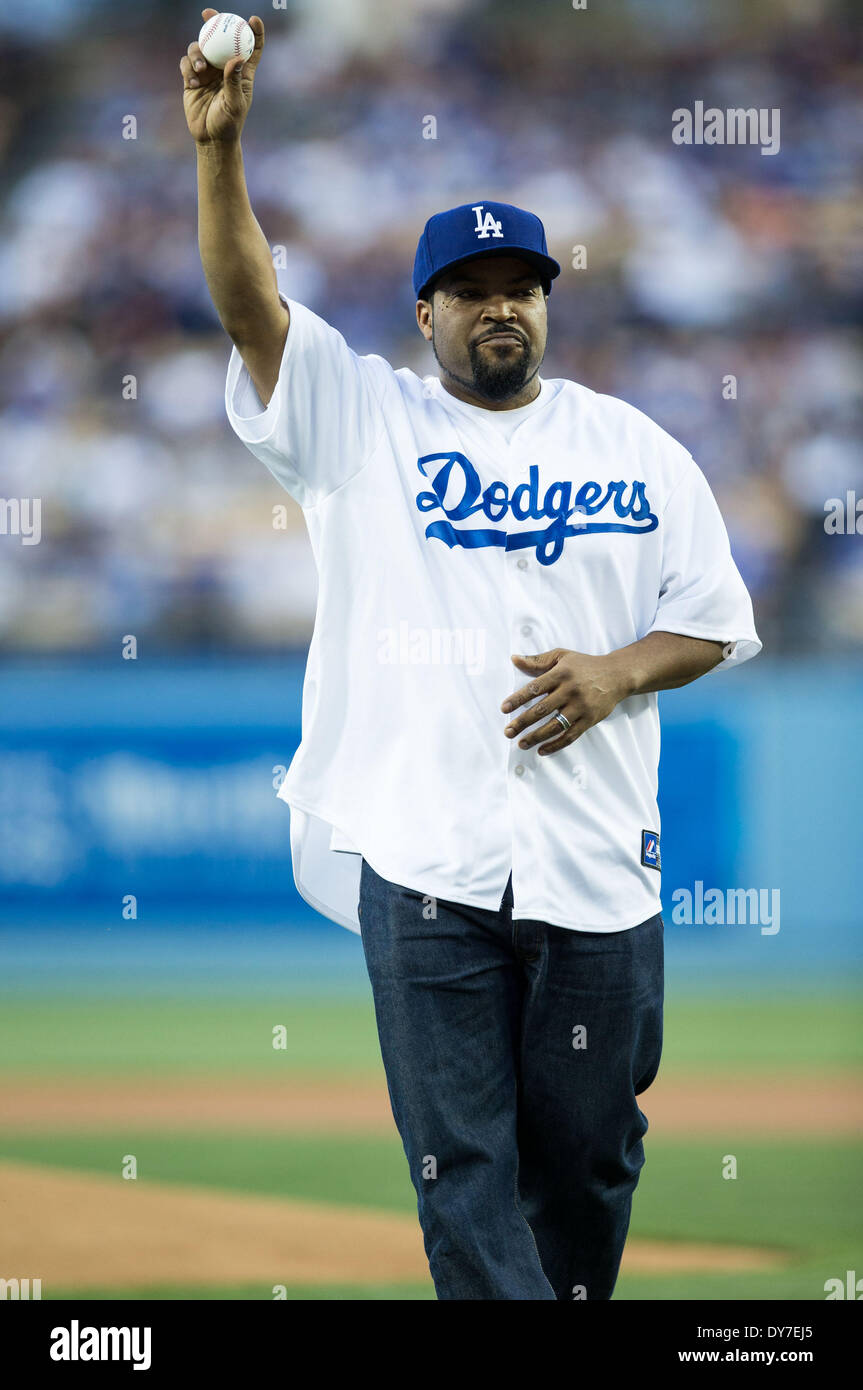 Los Angeles, CA, USA. 8th Apr, 2014. Rap Artist Ice Cube holds the baseball  up in the air for the fans after throwing the ceremonial first pitch before  the MLB game between