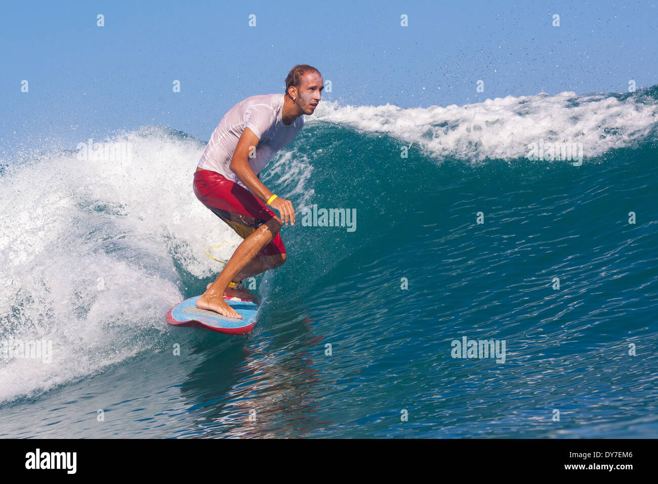 Surfing a wave in Indian ocean Stock Photo Alamy