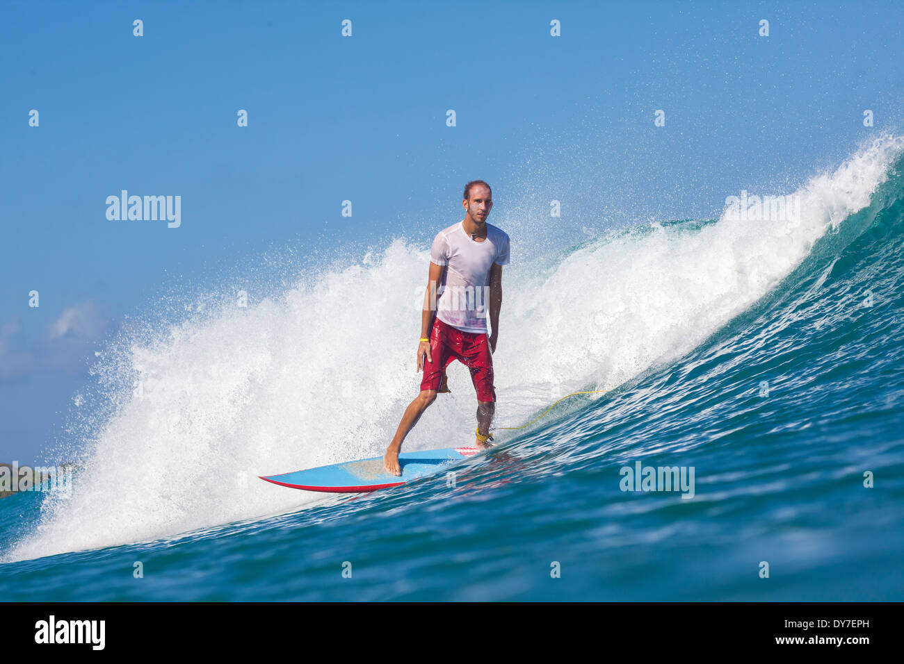 Surfing a wave in Indian ocean Stock Photo Alamy