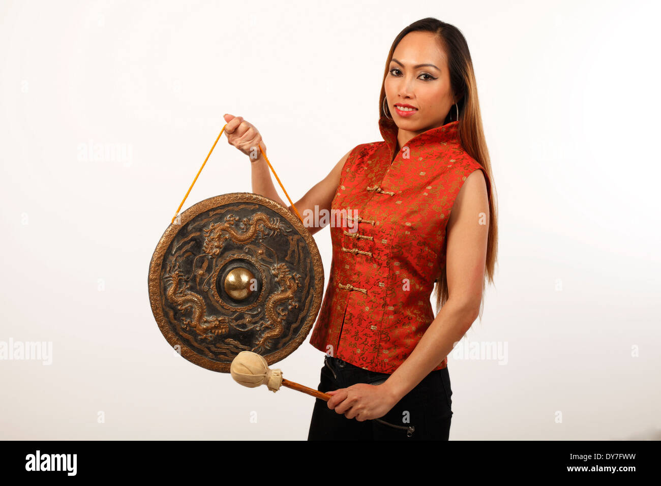Chinese Gong played by an Asian or Oriental lady Stock Photo - Alamy