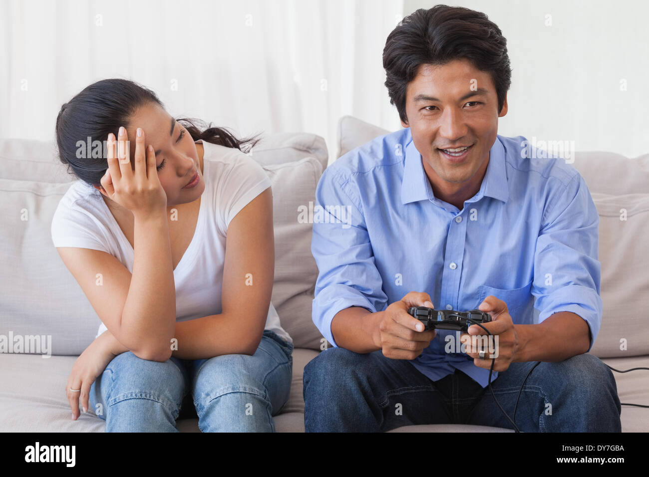 Annoyed Girlfriend Waiting for Boyfriend To Stop Playing Video-games Stock  Photo - Image of game, gamer: 100430632