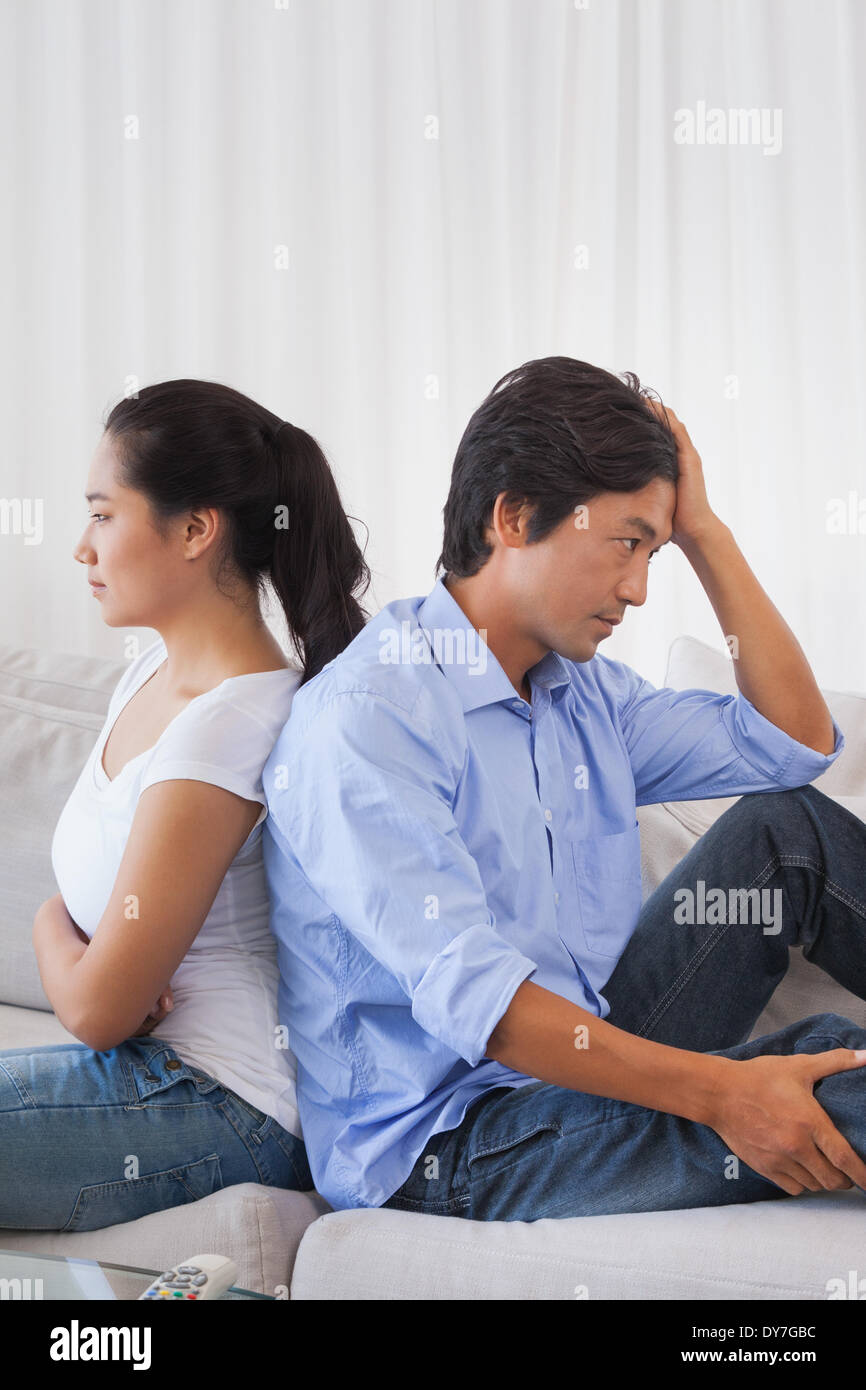 Couple not talking after a dispute on the sofa Stock Photo - Alamy