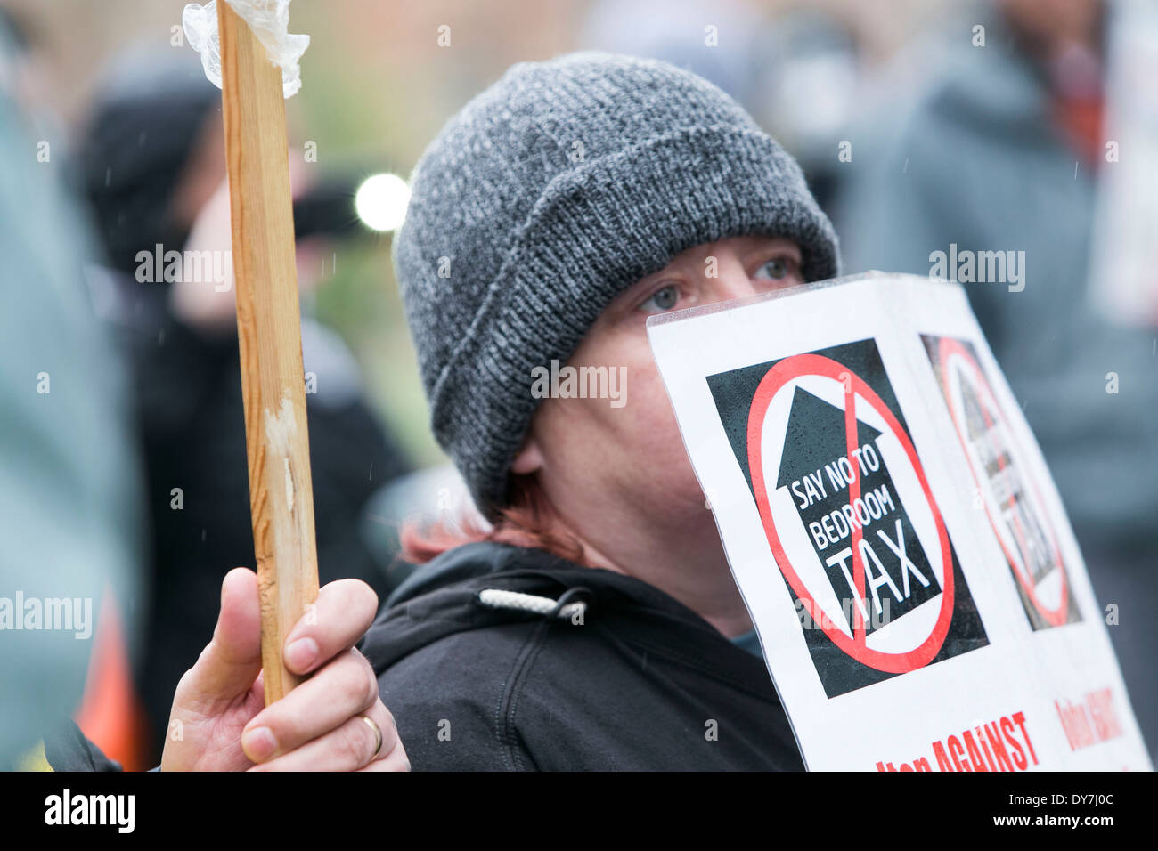 Protestors march through Manchester City Centre today (Sat 05/04/14) in opposition to the bedroom tax. Stock Photo