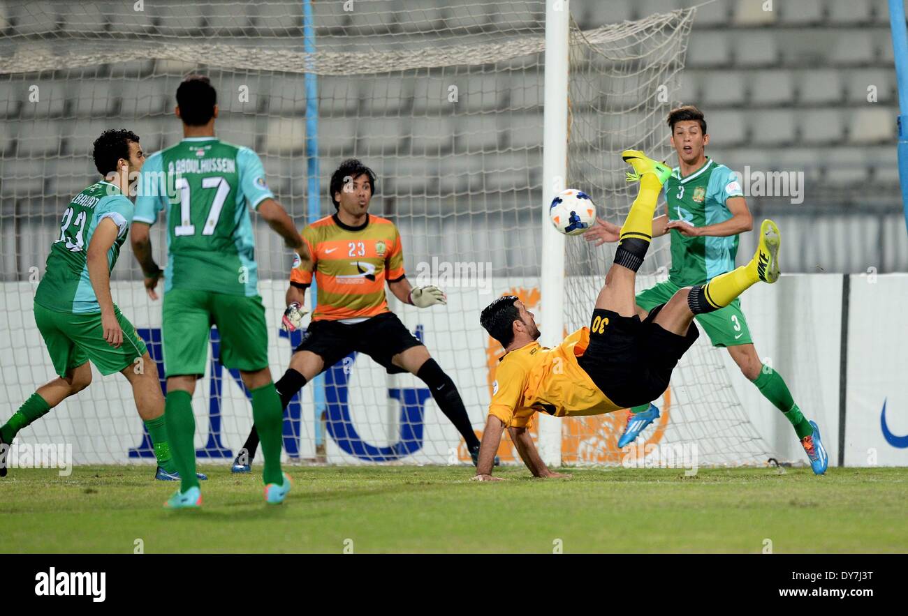 Boao, R) of Kuwait's Qadsia SC tries to score against Iraq's Al Shorta