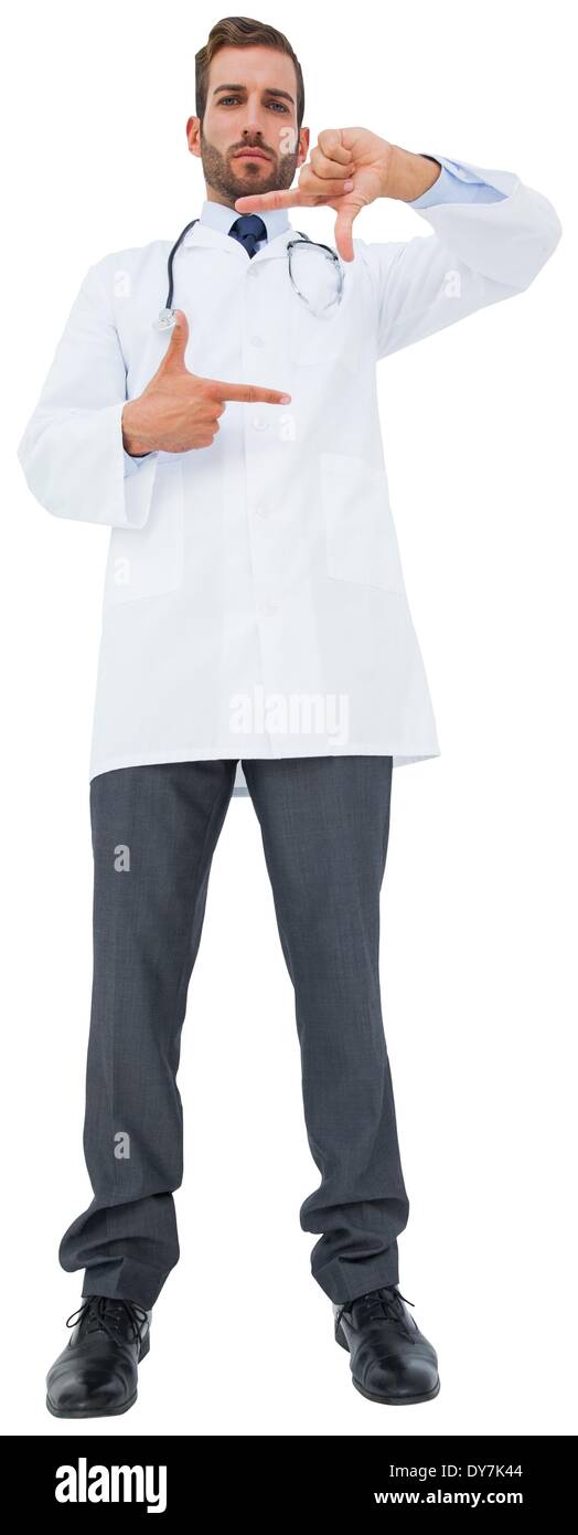 Handsome young doctor gesturing with hands Stock Photo