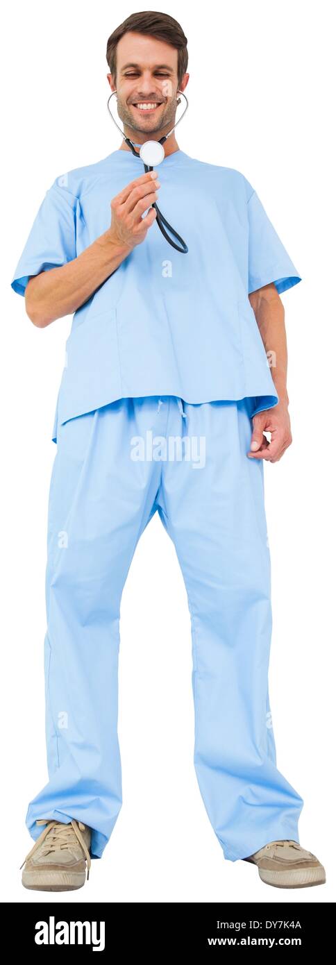 Handsome surgeon in blue scrubs using stethoscope Stock Photo