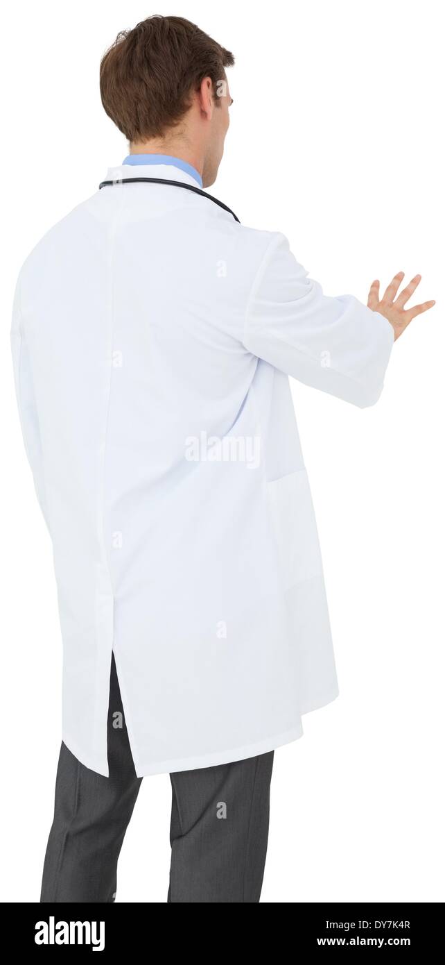 Young doctor in lab coat gesturing Stock Photo