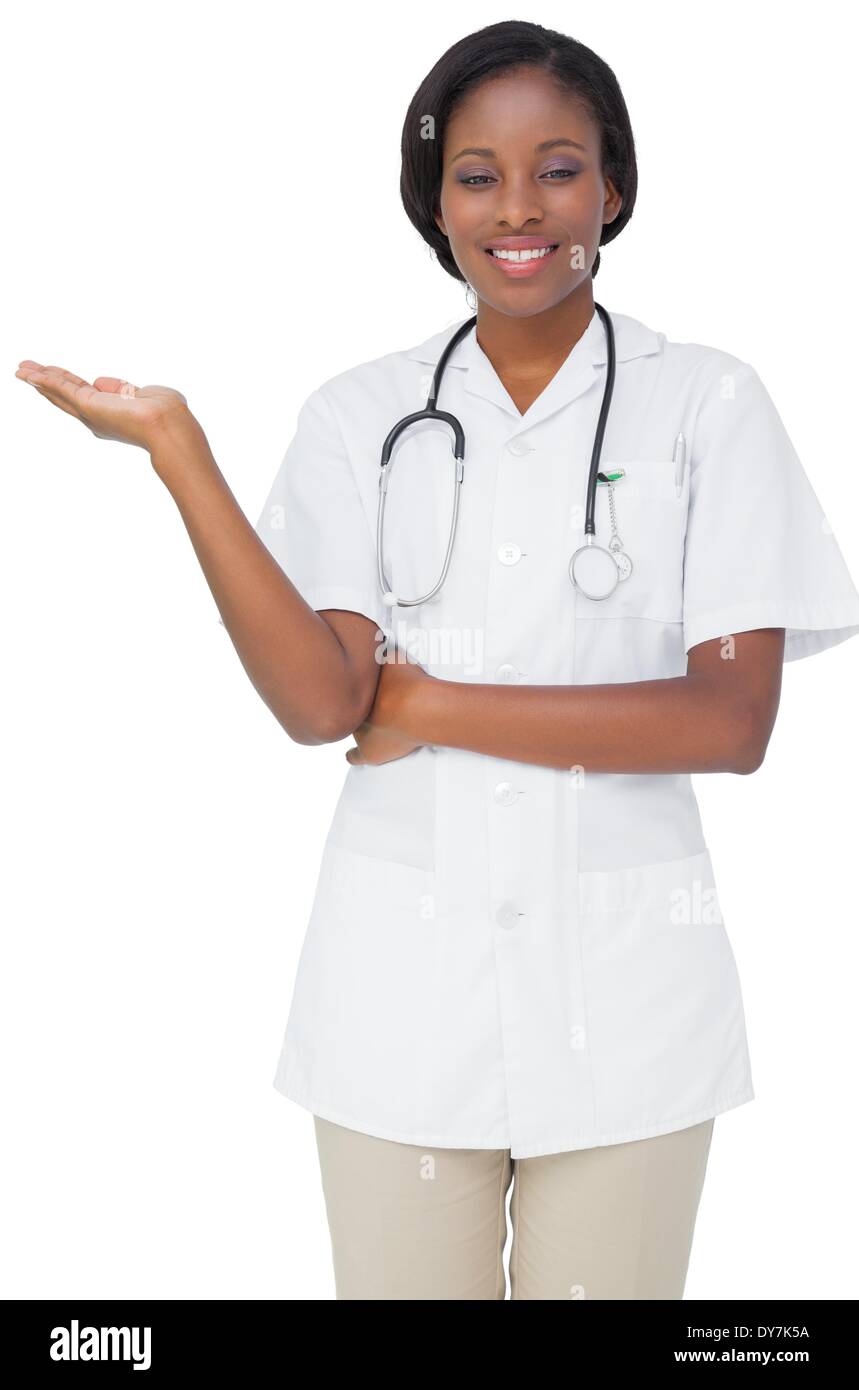 Young nurse in tunic presenting Stock Photo
