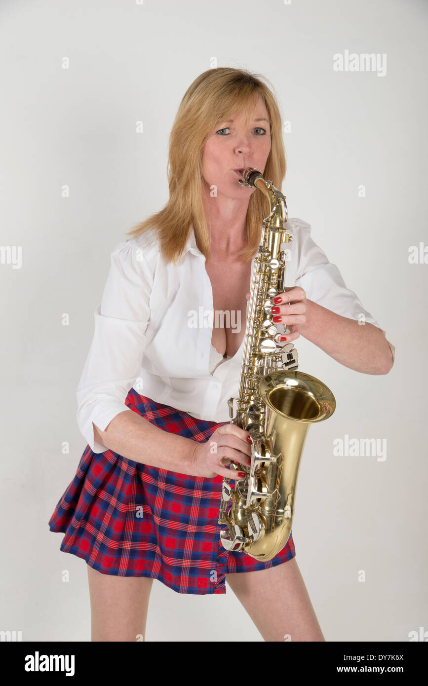 Portrait of a woman playing an Alto saxophone Stock Photo