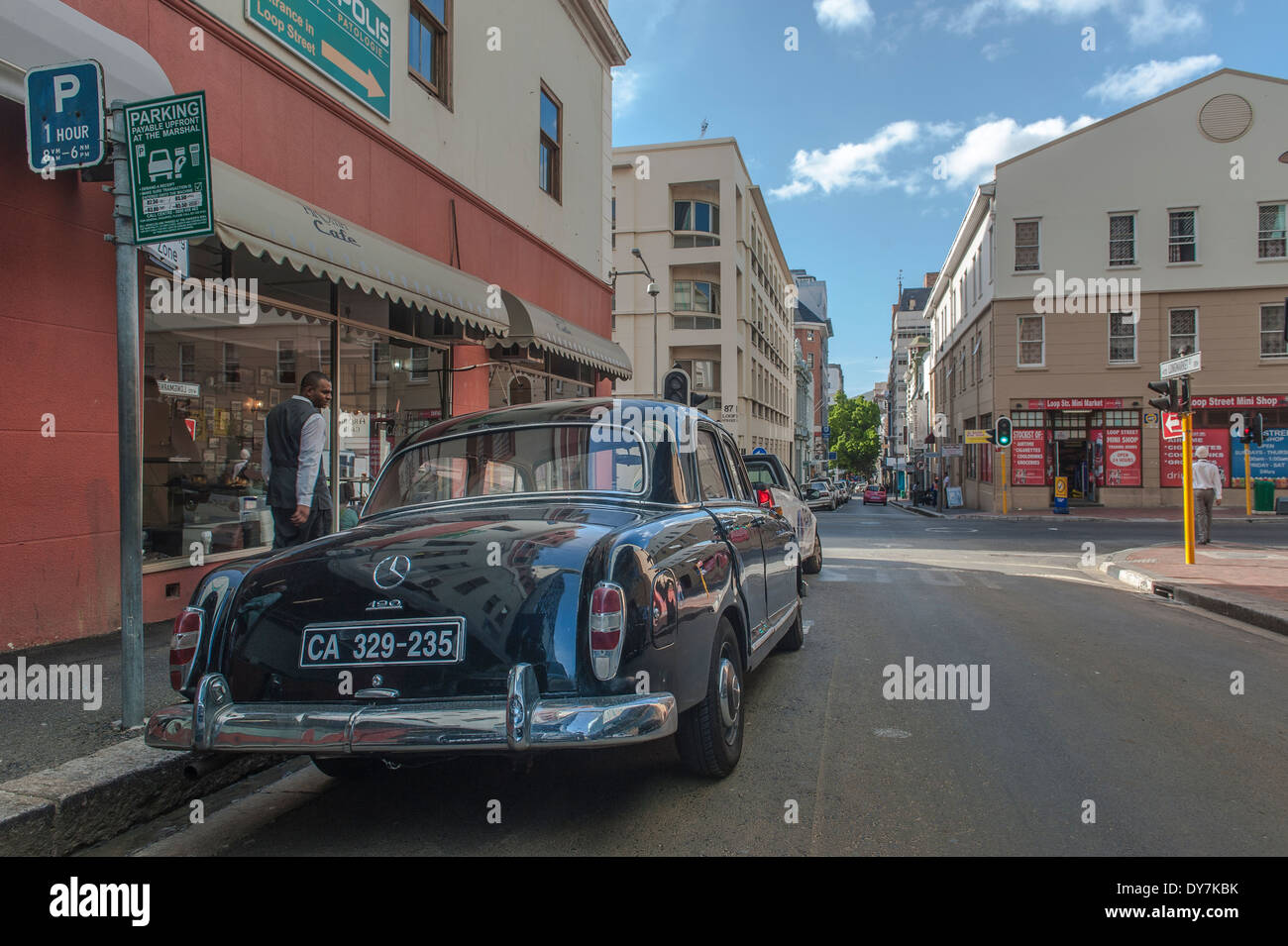 Back view of a black Mercedes 190 parked in a street in Cape Town, Western Cape, South Africa Stock Photo