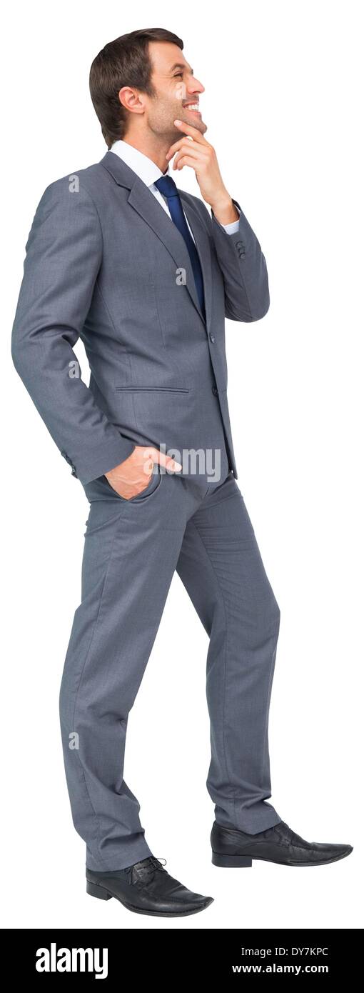 Thinking businessman touching his chin Stock Photo