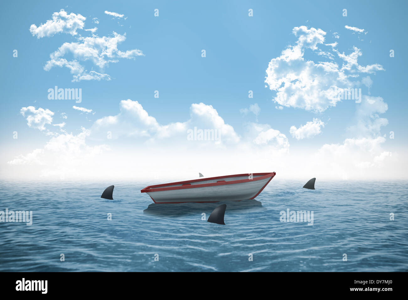 Sharks circling small boat in the ocean Stock Photo