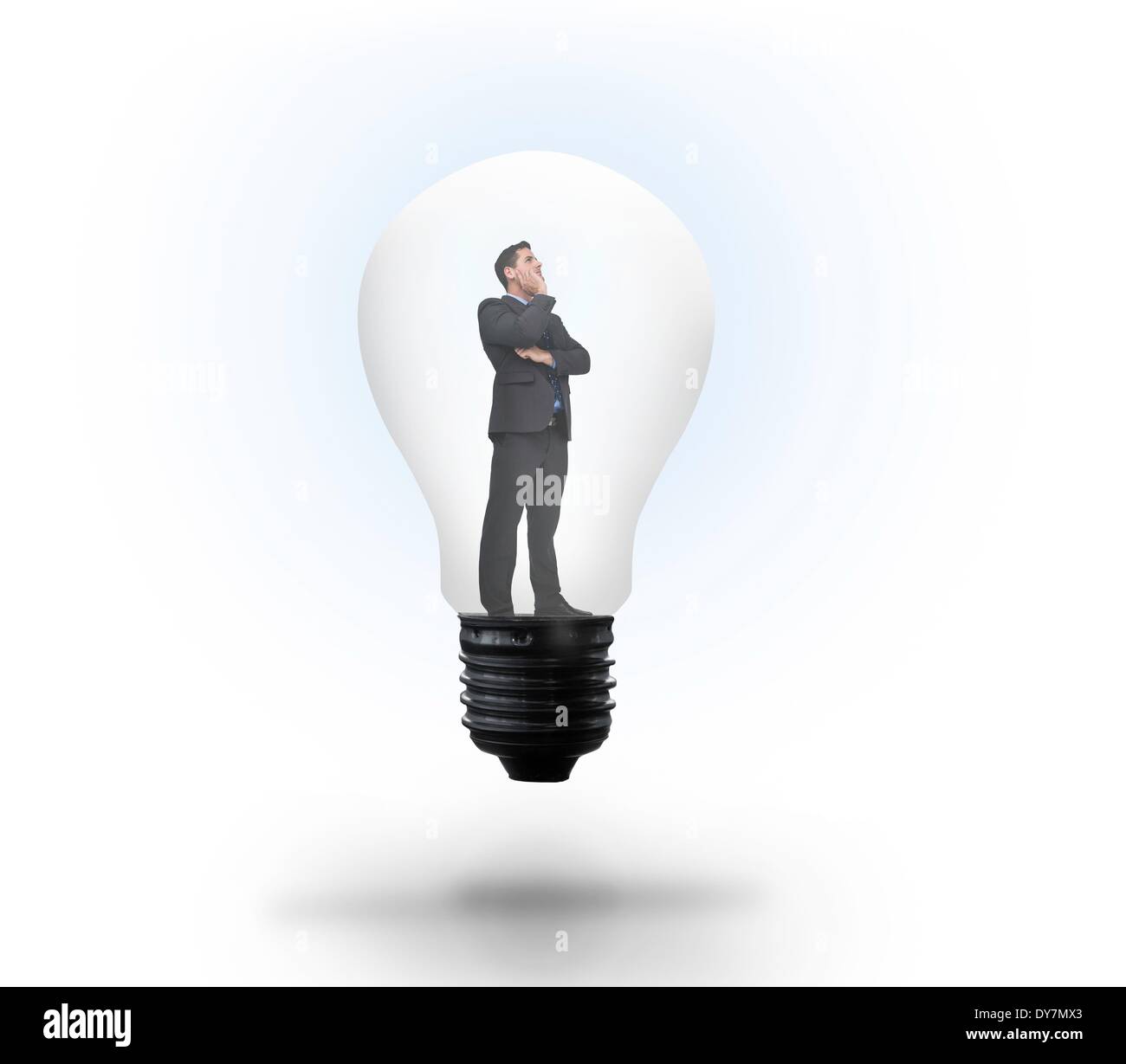 Thinking businessman in light bulb Stock Photo