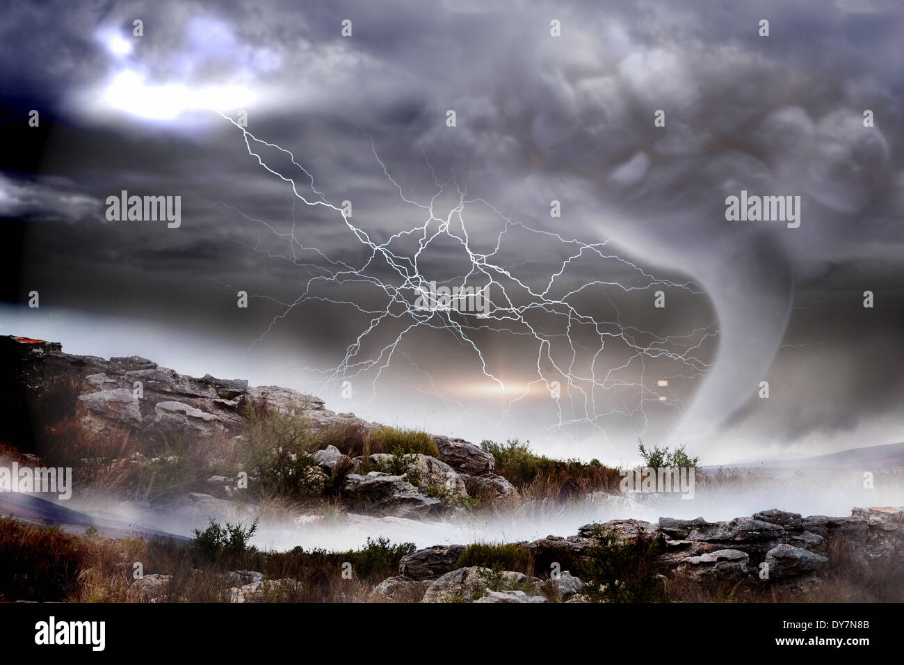 Stormy sky with tornado over landscape Stock Photo - Alamy