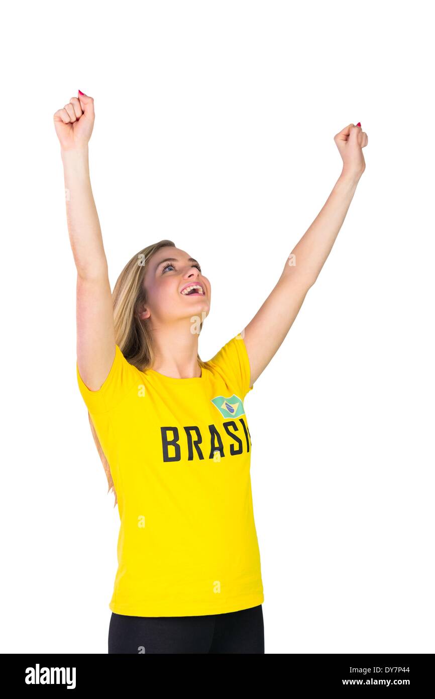 Excited football fan in brasil tshirt on white background Stock Photo