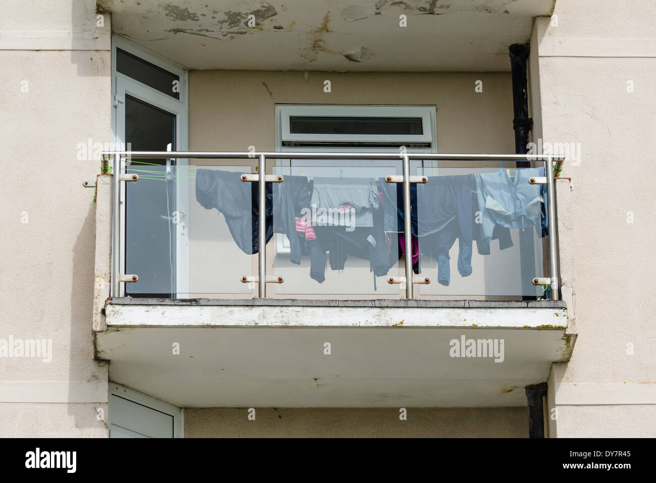 Washing hanging up to dry on a balcony Stock Photo Alamy