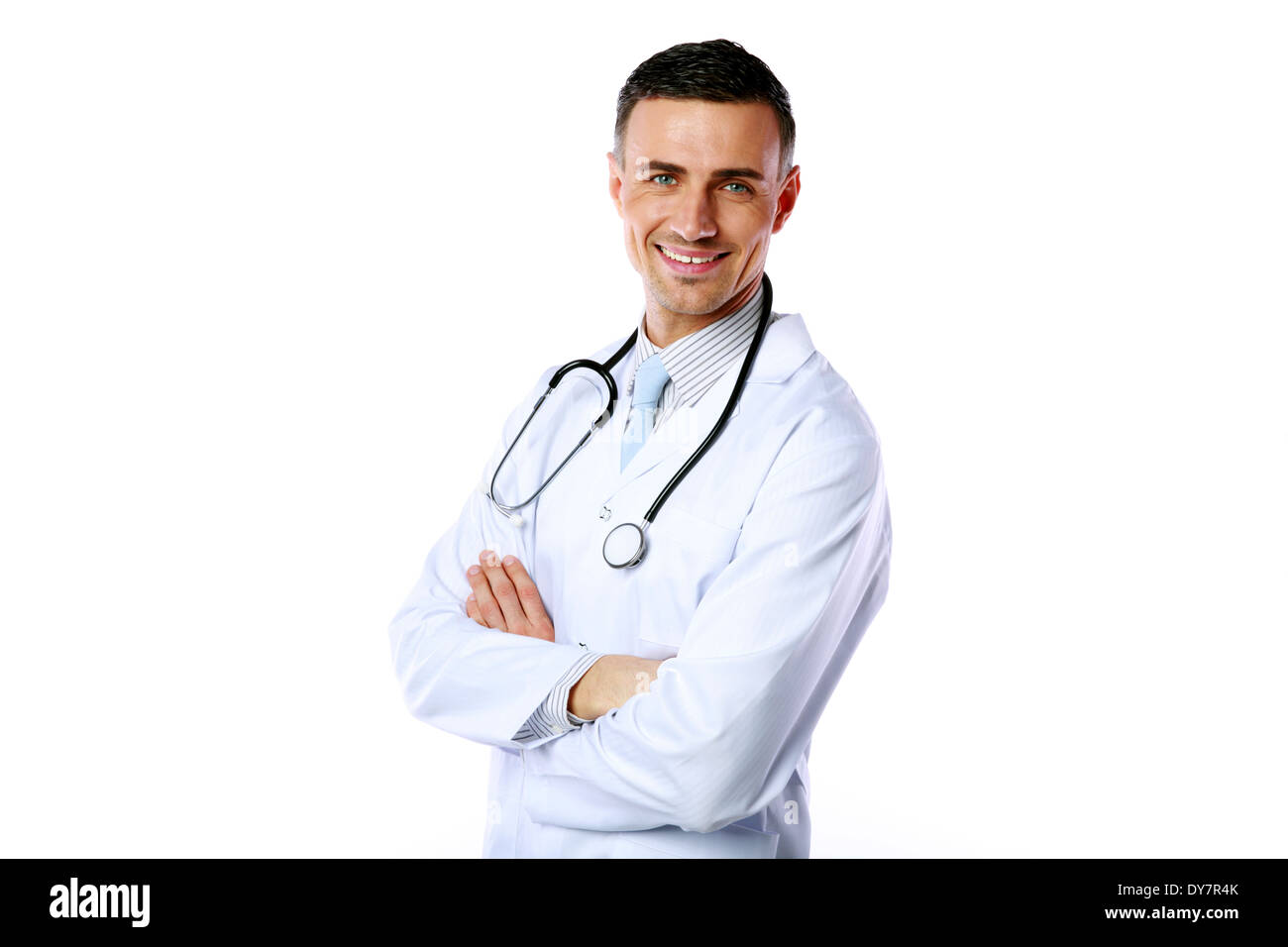Portrait of a smiling male doctor with arms folded over white background Stock Photo