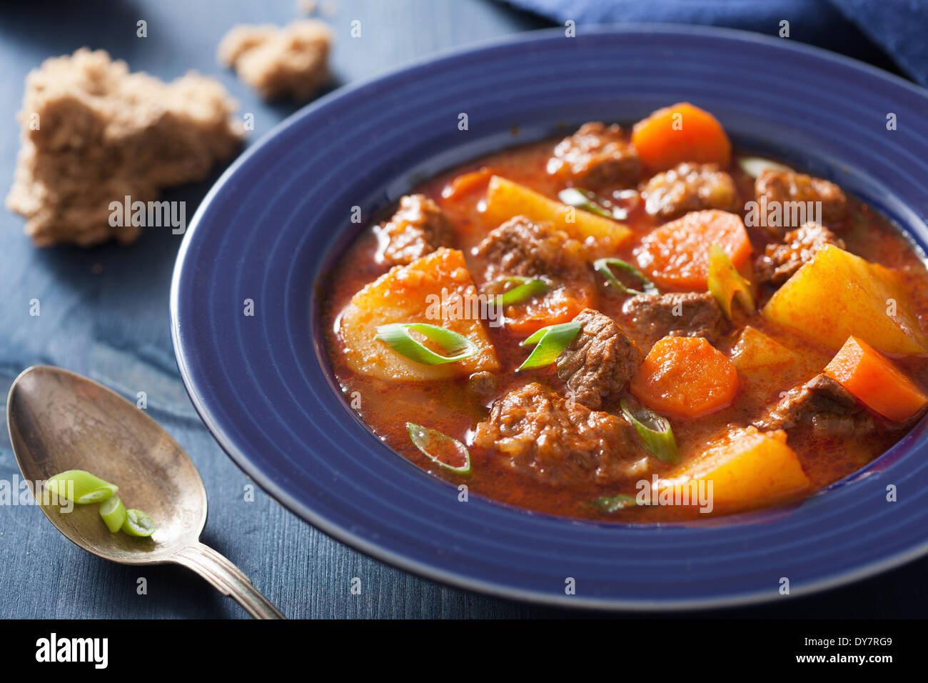 beef stew with potato and carrot in blue plate Stock Photo Alamy