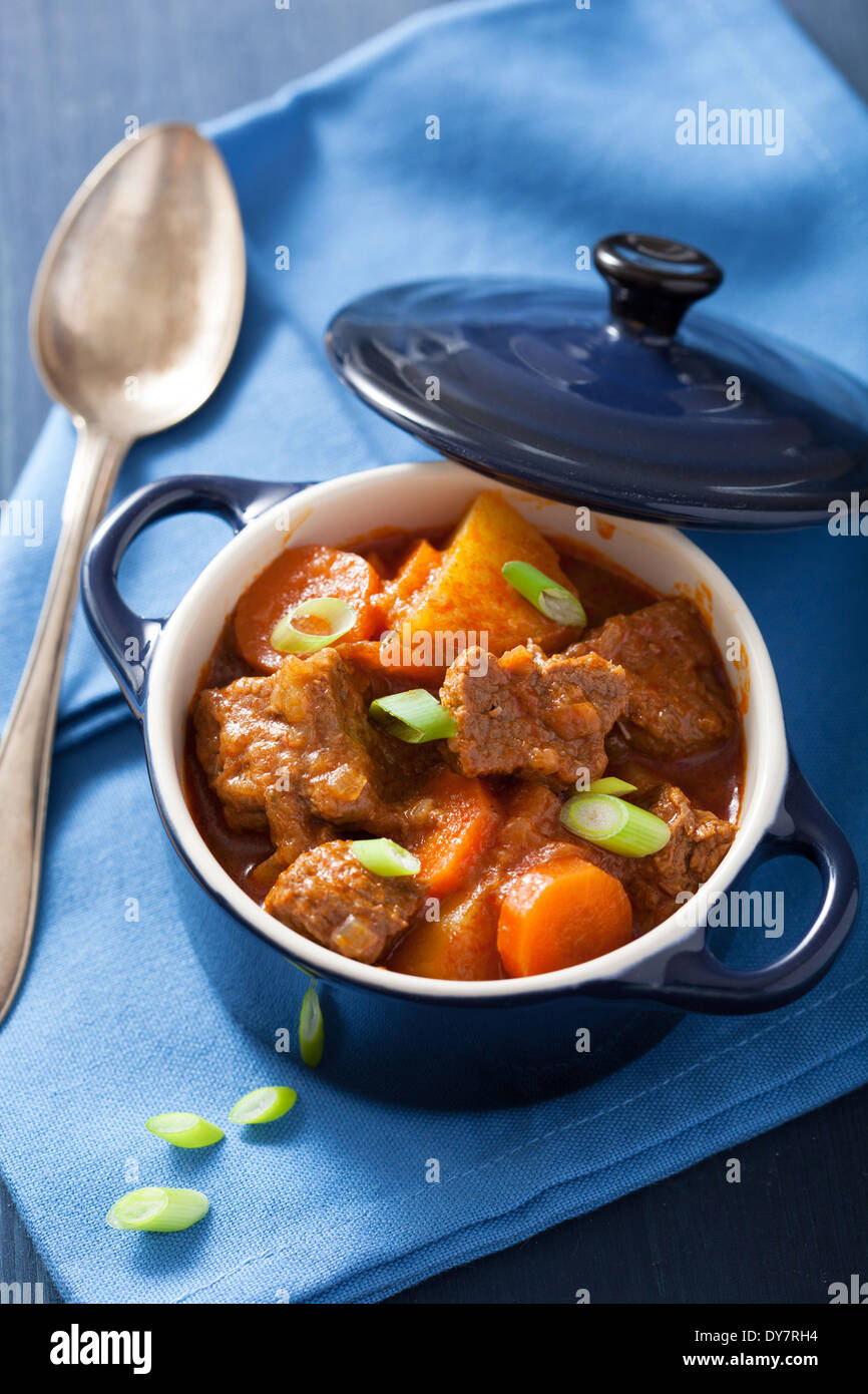 beef stew with potato and carrot in blue pot Stock Photo
