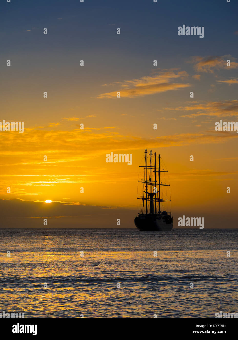 Caribbean, St. Lucia, Sailing cruise ship Wind Star at sunset Stock