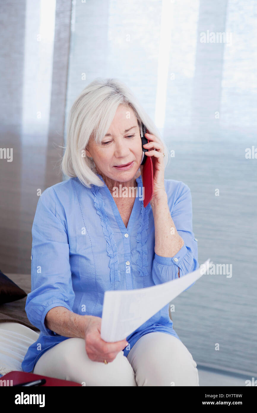 Elderly person on the phone Stock Photo