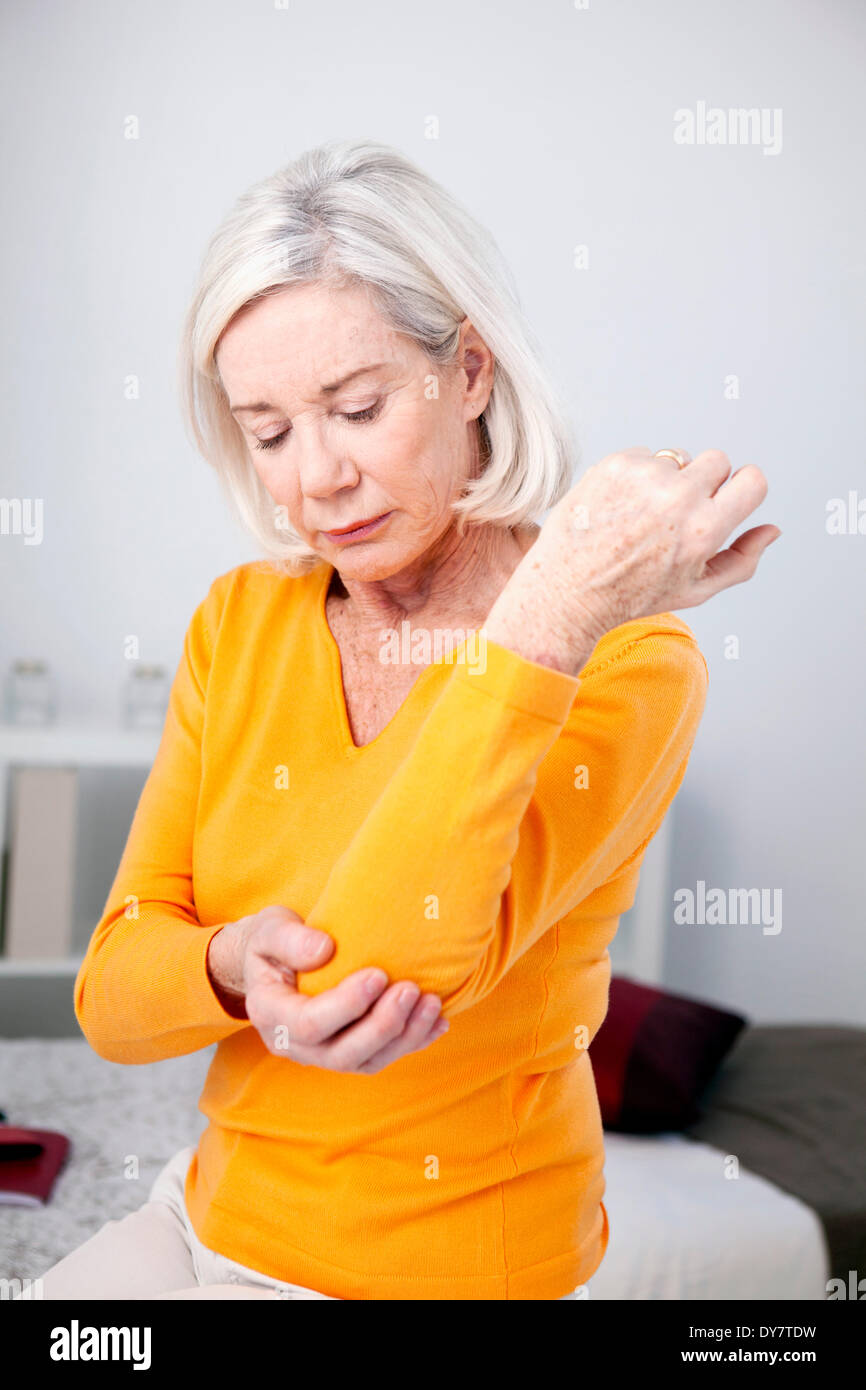 Elbow pain in an elderly person Stock Photo Alamy