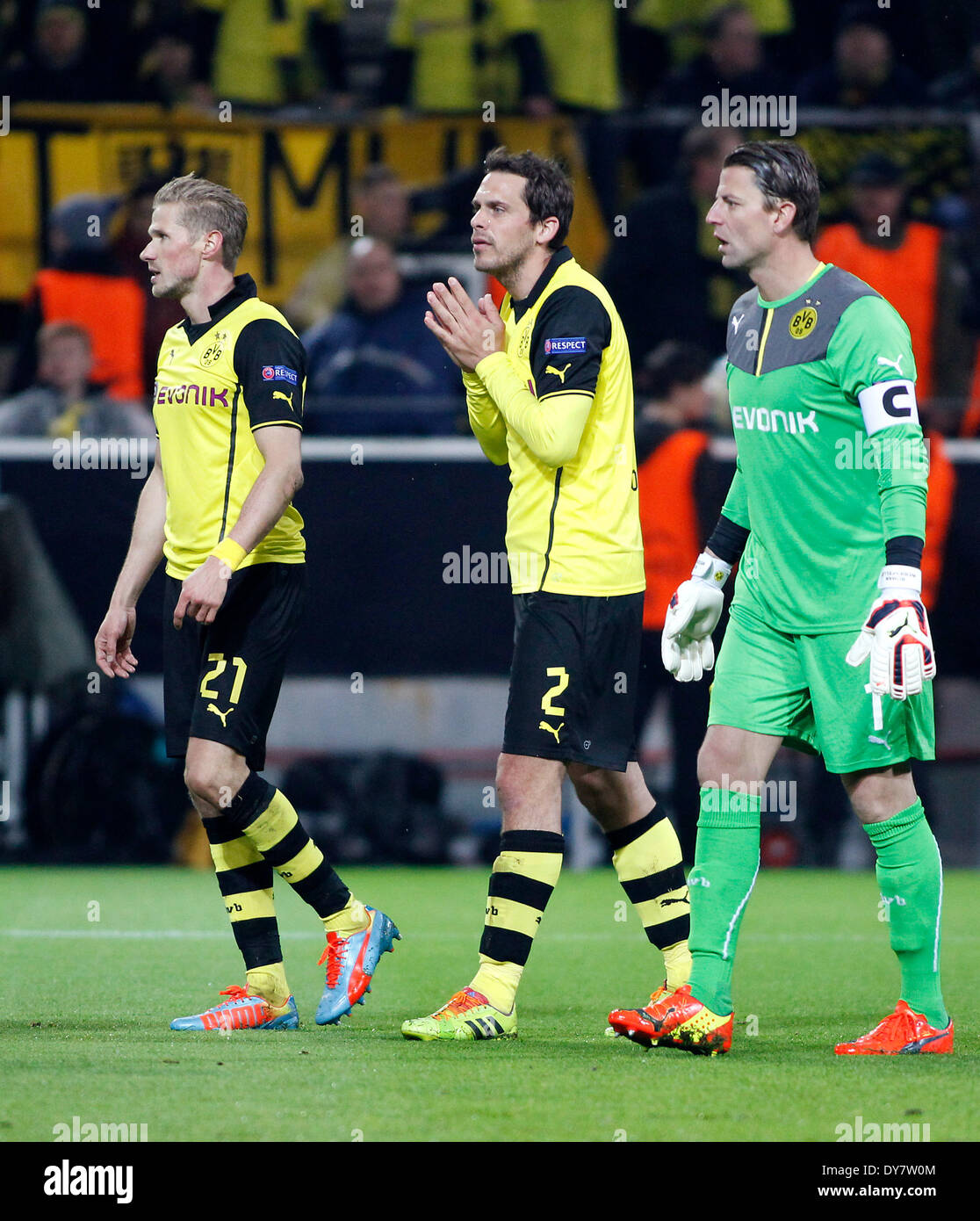 Dortmunds Manuel Friedrich (M) and Roman Weidenfeller (R) disappointed during the UEFA Champions League quarter final match between Borussia Dortmund and Real Madrid, Signal Iduna Park in Dortmund on April 08, 2014. Stock Photo