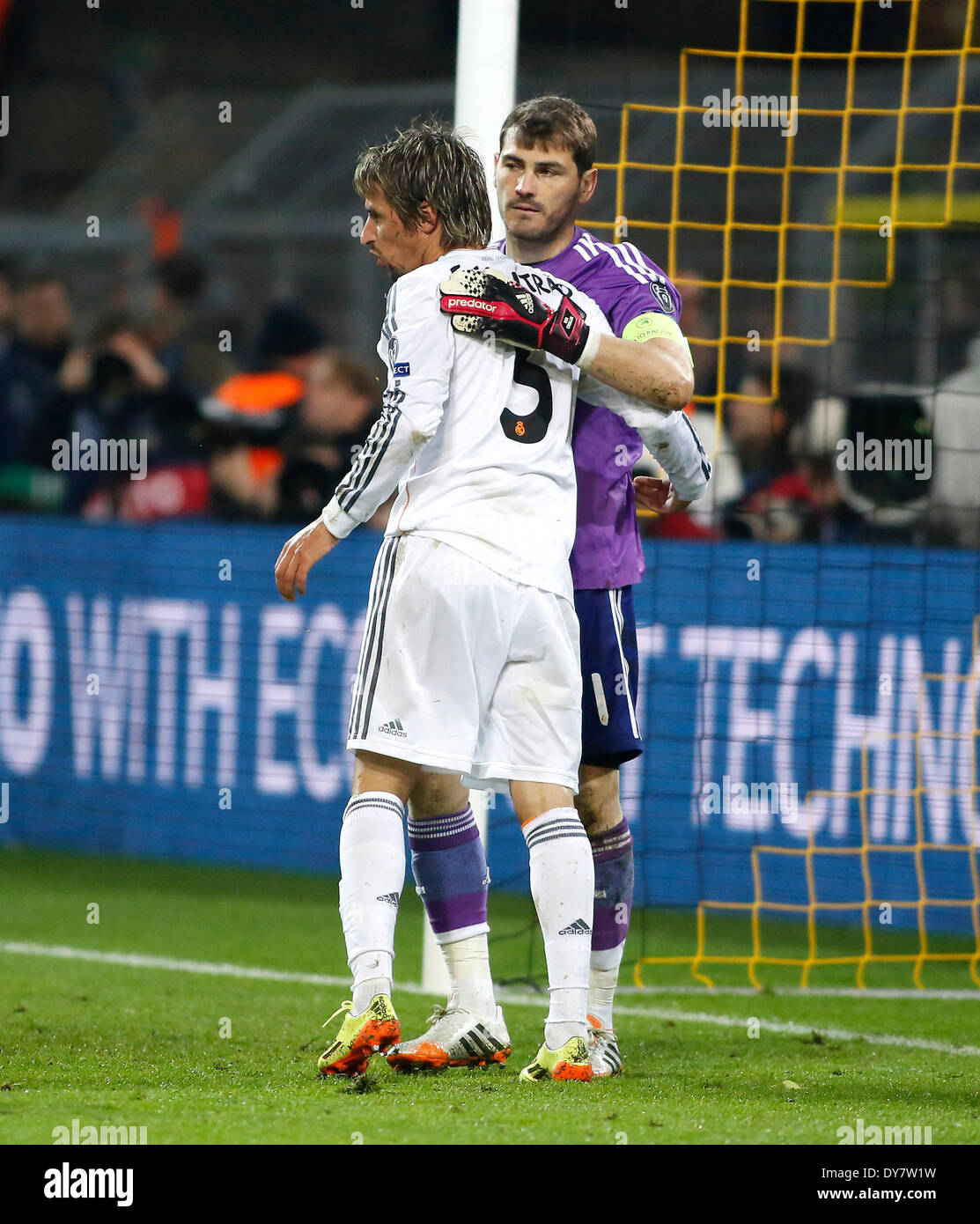 Madrids goalkeeper Iker Casillas (R) celebrates the victory with Fabio Coentrao during the UEFA Champions League quarter final match between Borussia Dortmund and Real Madrid, Signal Iduna Park in Dortmund on April 08, 2014. Stock Photo