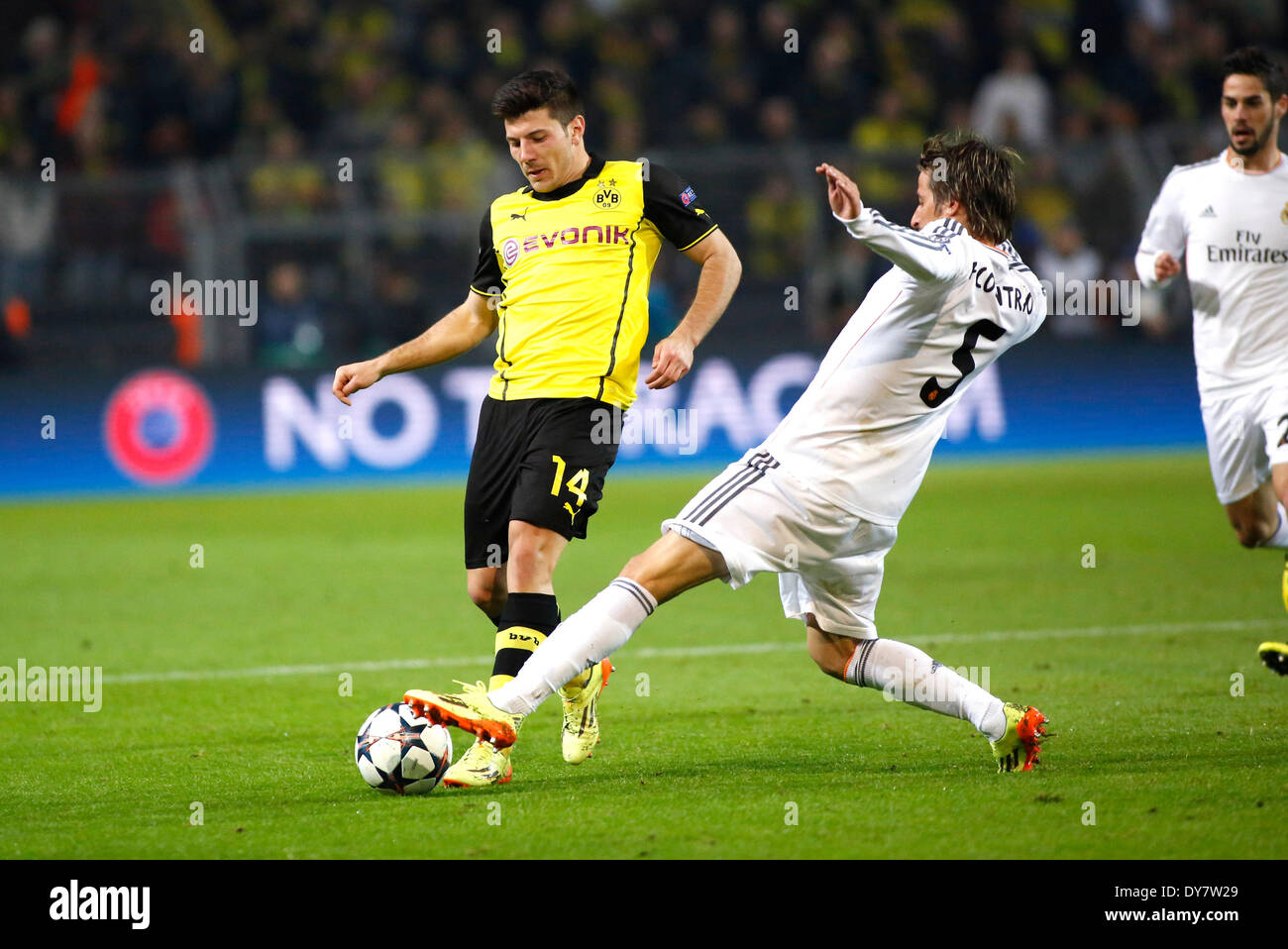 Dortmunds Milos Jojic (L) against Madrids Fabio Coentrao during quarterfinals of the Champions League match between Borussia Dortmund and Real Madrid, Signal Iduna Park in Dortmund on April 08., 2013. Stock Photo