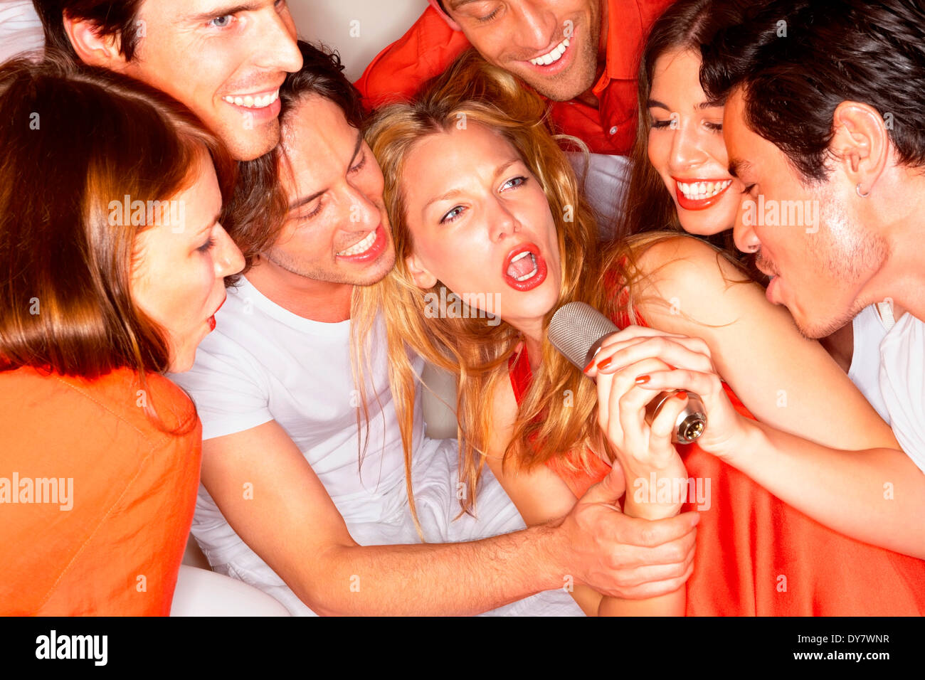 young-people-singing-together-in-a-night-club-stock-photo-alamy