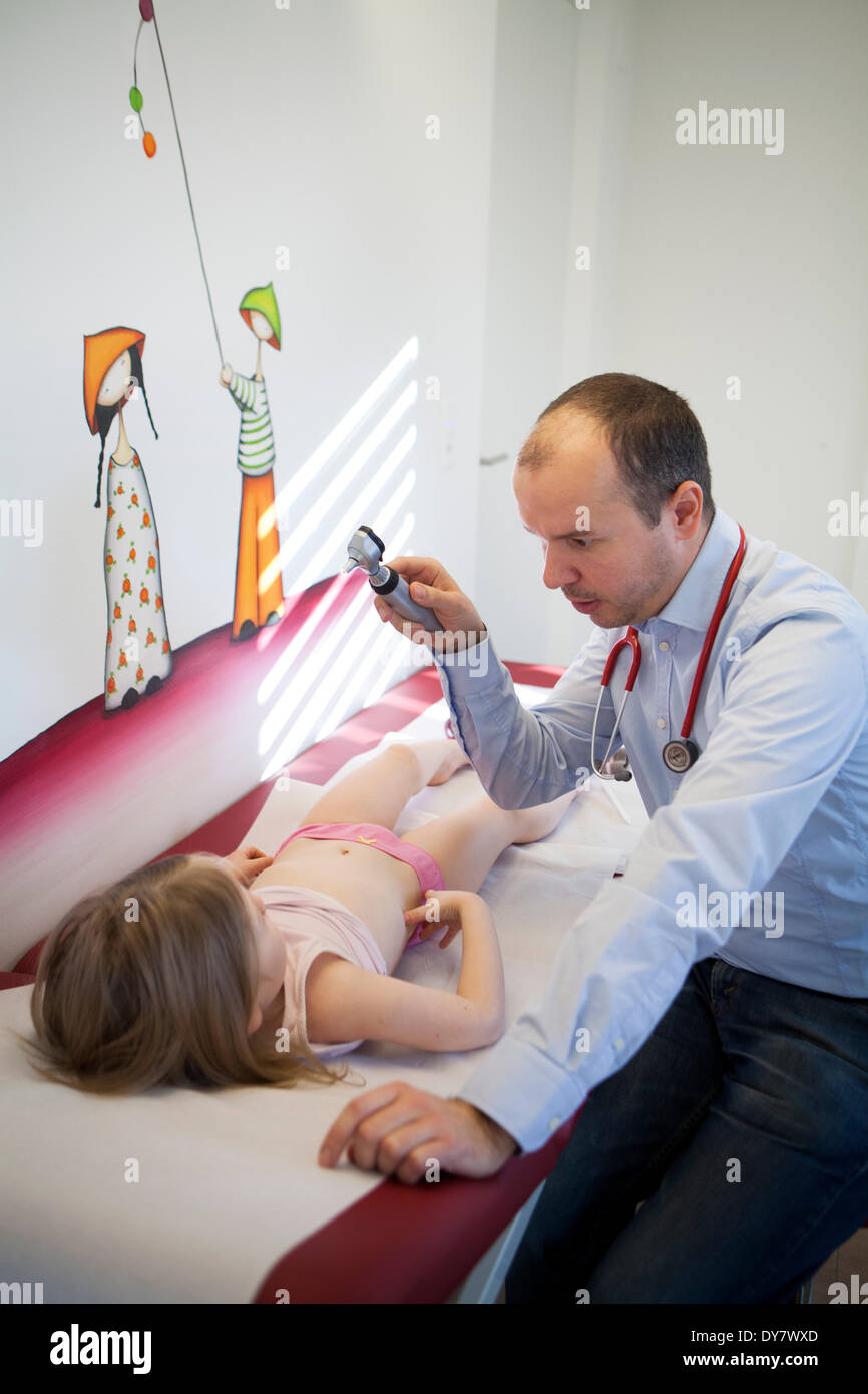 Otoscope examination child laying hires stock photography and images Alamy