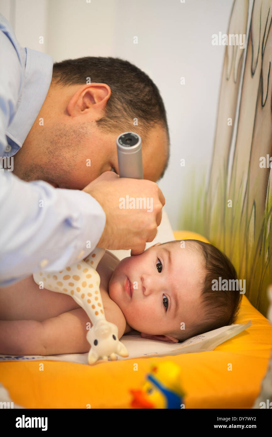 Otoscope examination child laying hires stock photography and images Alamy