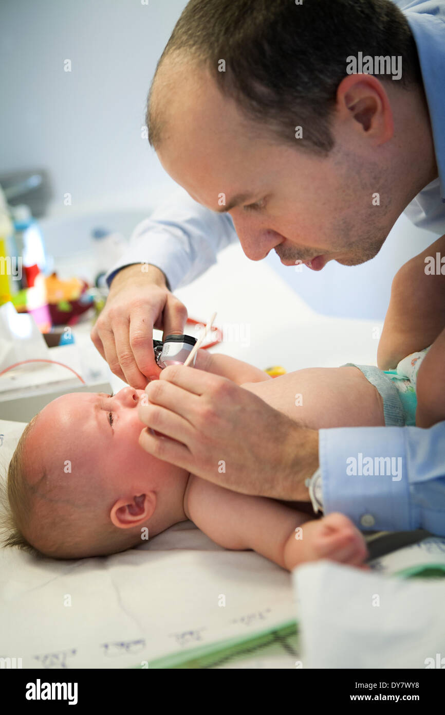 Otoscope examination child laying hires stock photography and images Alamy