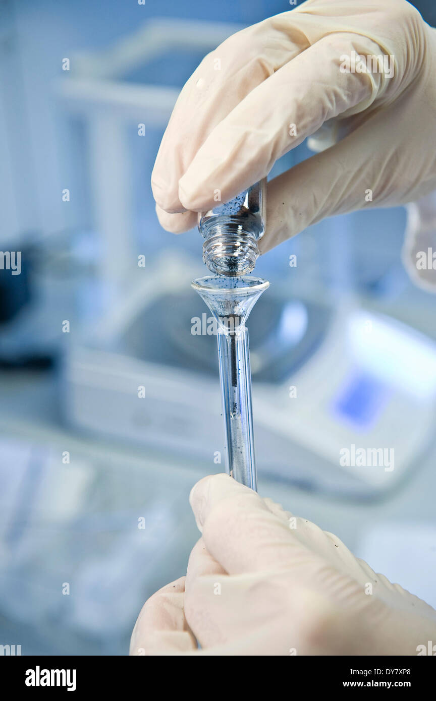 Small funnel being filled, in a laboratory, Germany Stock Photo
