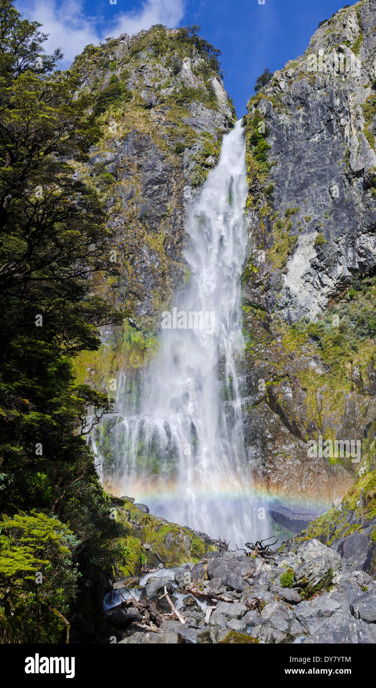 Waterfall with a rainbow, Devil's Punchbowl Falls, Arthur's Pass, South Island, New Zealand Stock Photo